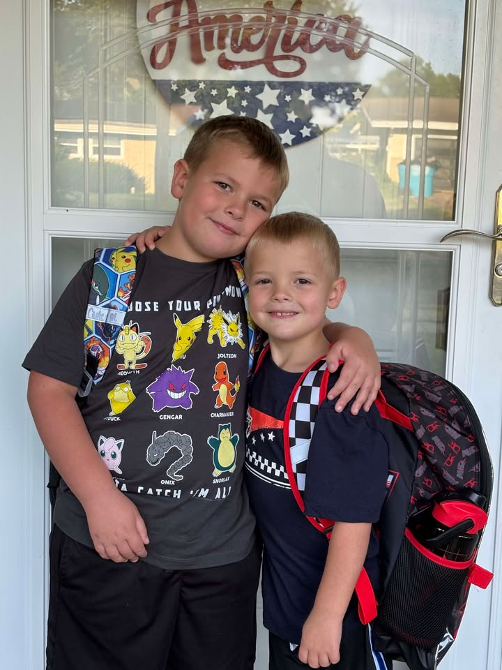 Two students wearing backpacks