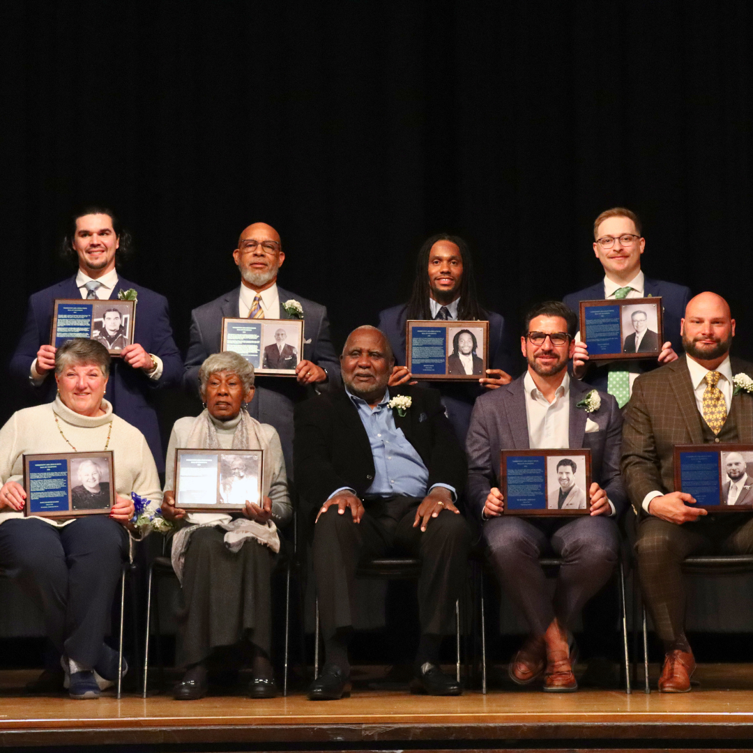 Hall of Champions and hall of fame Inductees holding their plaques 