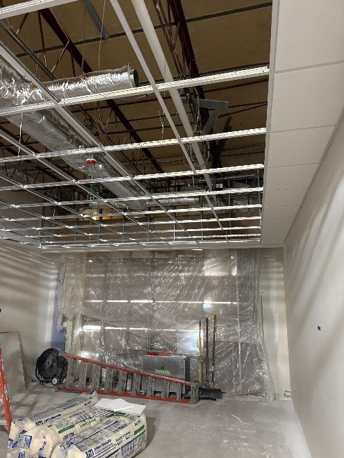 Ceiling grids and store fronts.