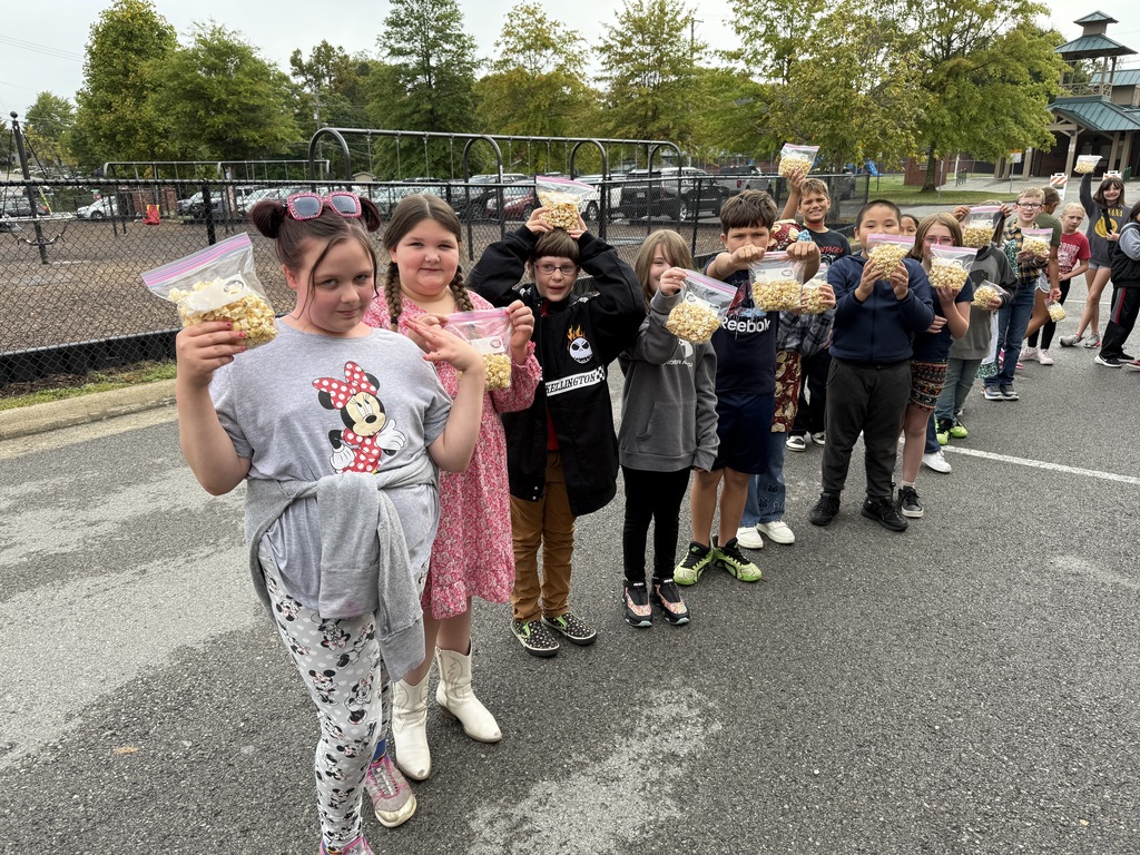 Students receive popcorn