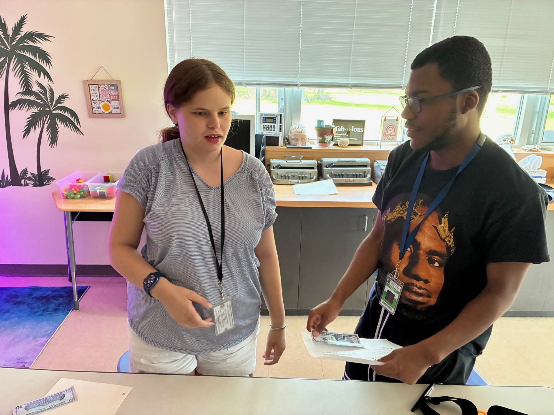 Kaylee and Jayden completing a transaction