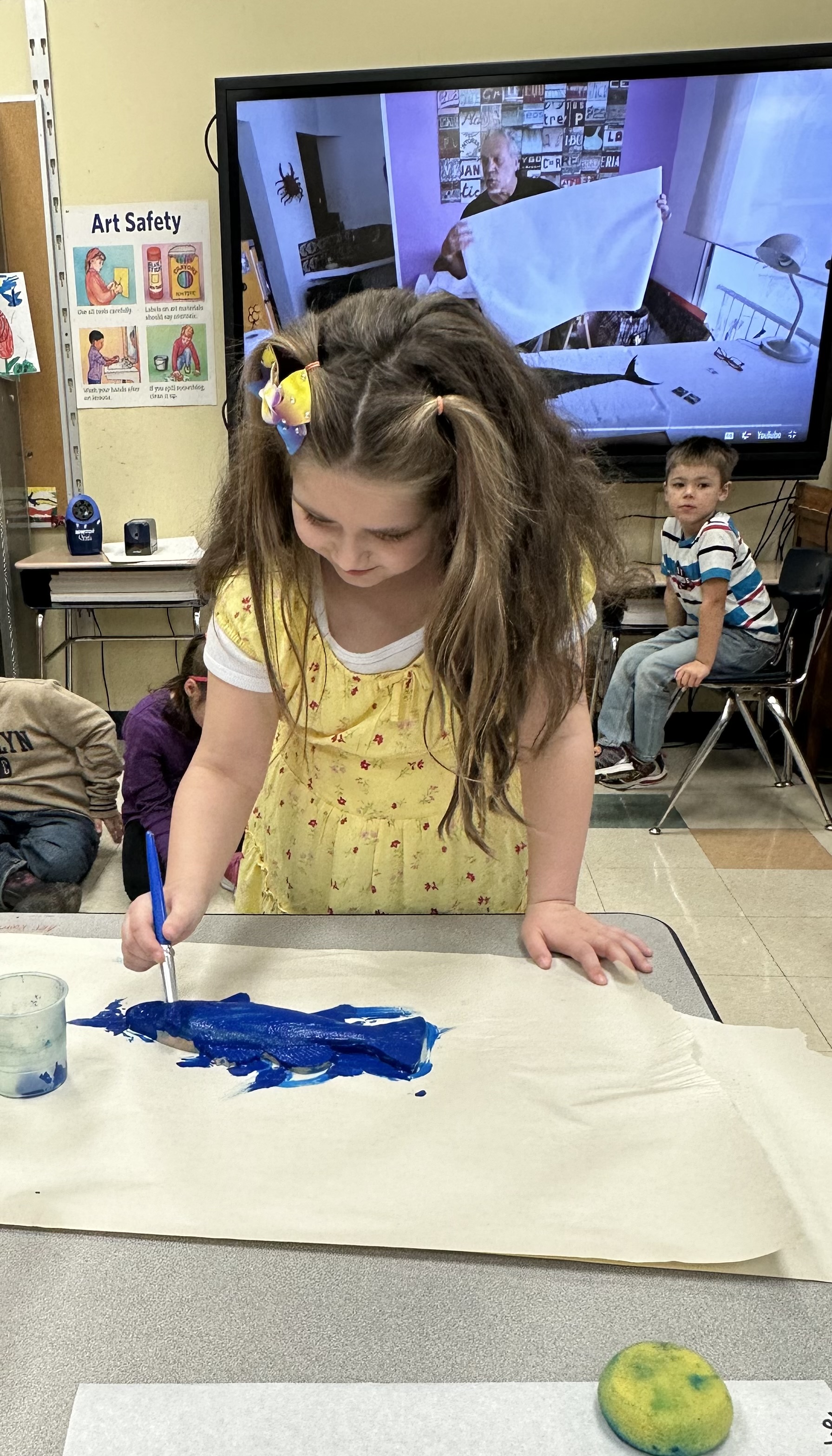 MJT student in art class - blue paint and fishes