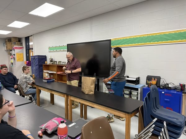 Mr. Peters and Mr. Cannon demonstrating a neck tie