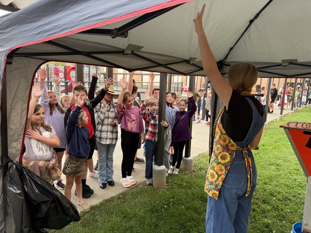 Students learn how to make apple cider
