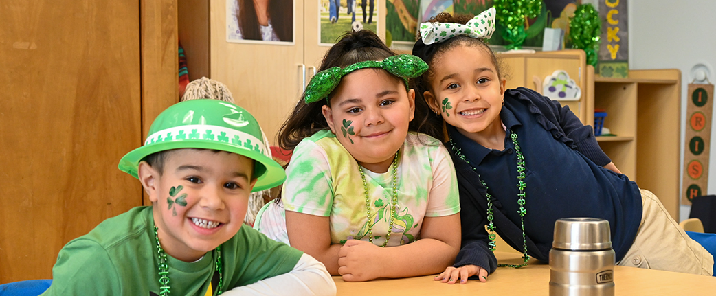 Three students dressed for St. Patrick's Day