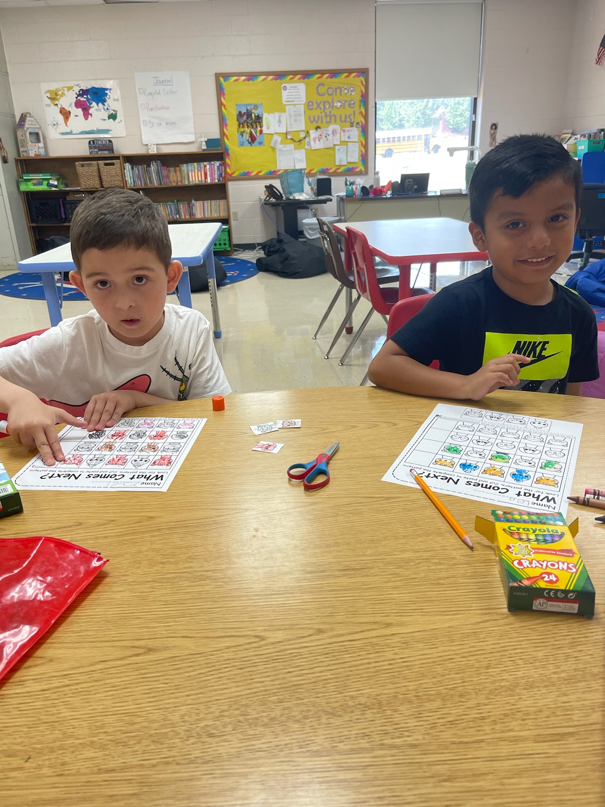 Kindergarten students work on completing patterns.