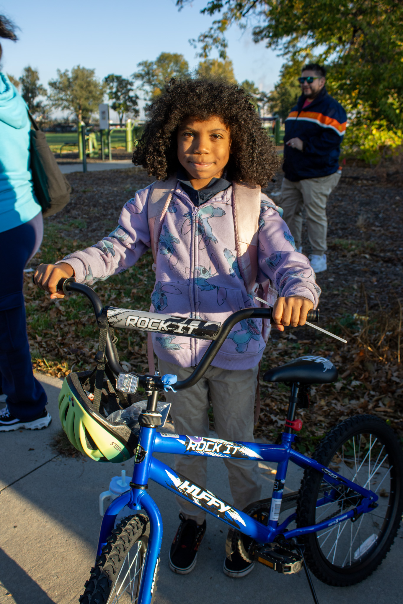 A student poses with the bike she won at the Swansea Walk N Roll to school event.