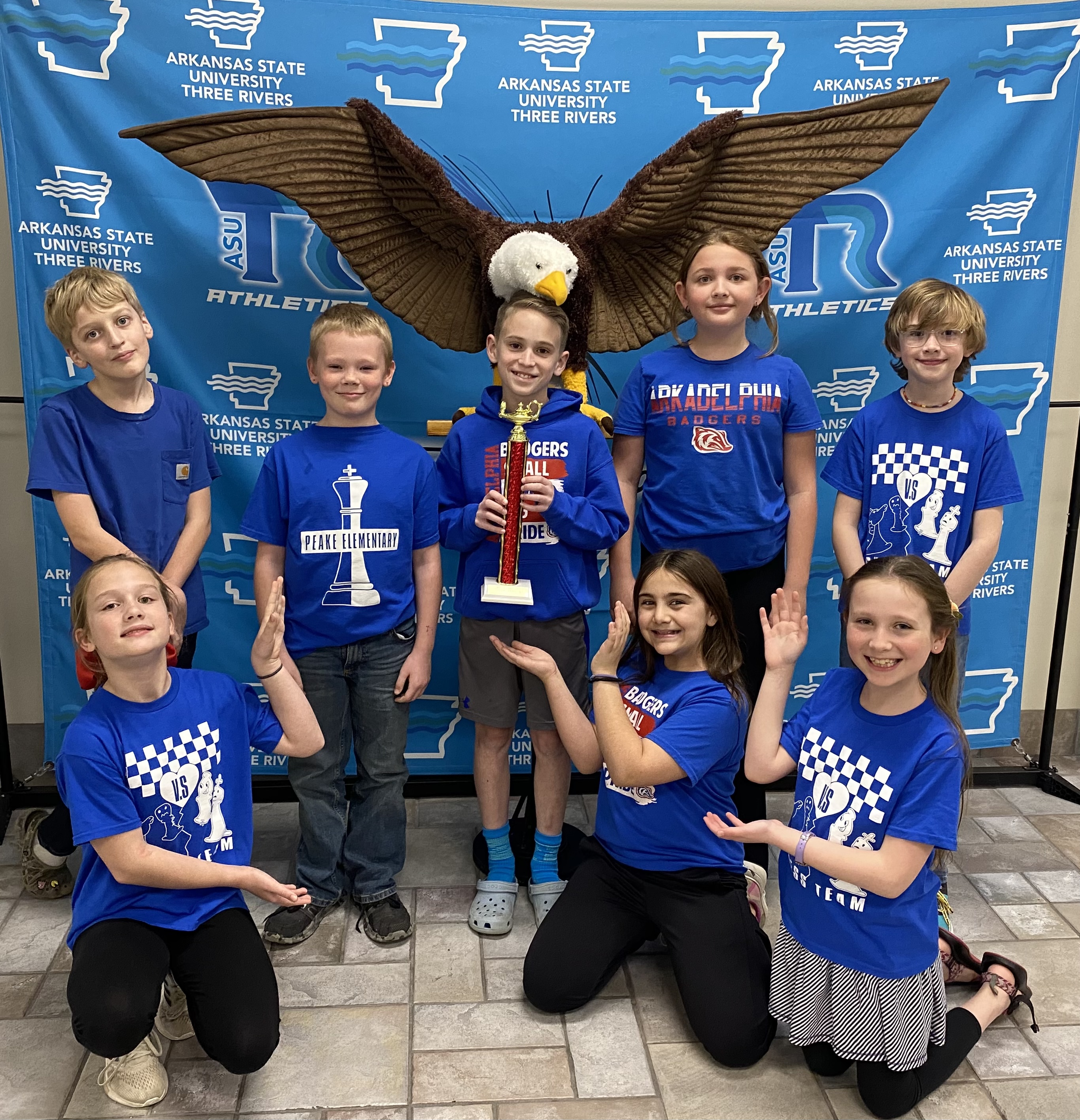 4th grade GT holding a second place trophy