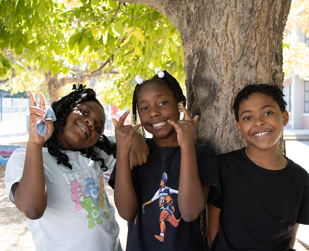 children smiling on playground