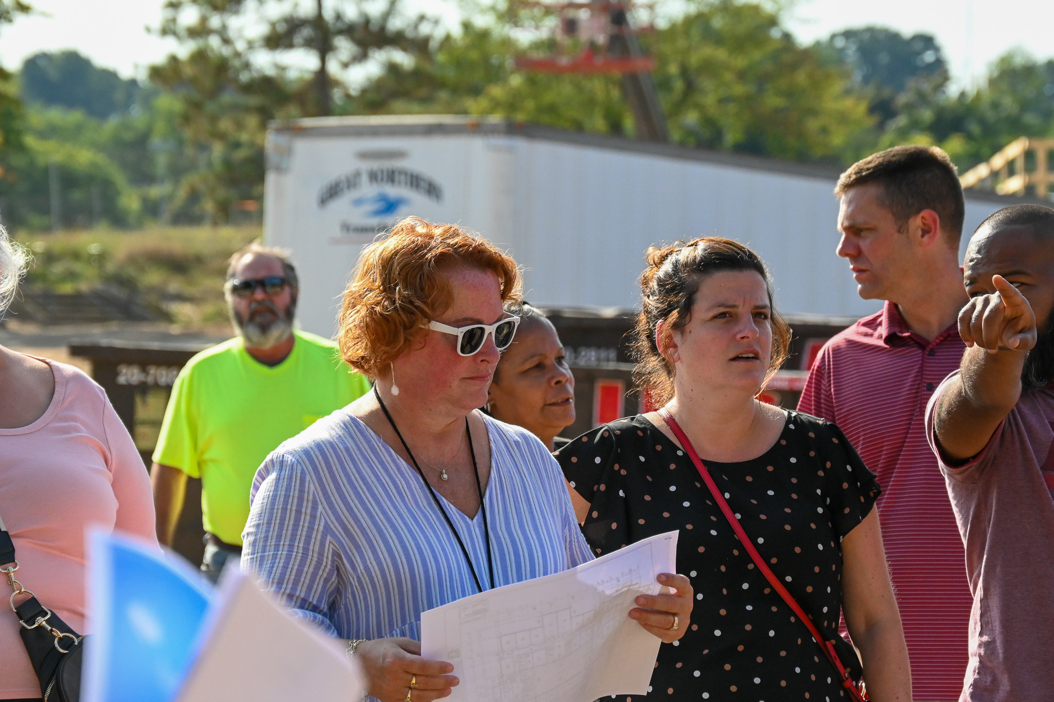 A group of people learn about the new middle school construction