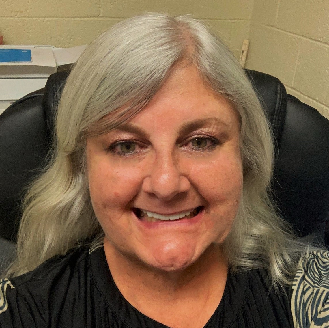 Mrs. Hilser smiling for the camera