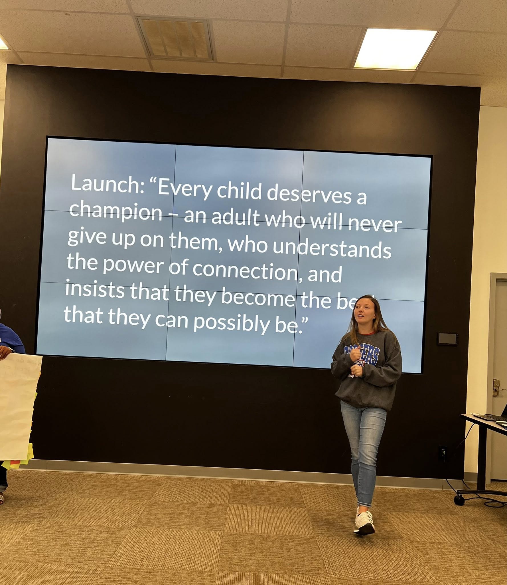 football player and duck greeting students