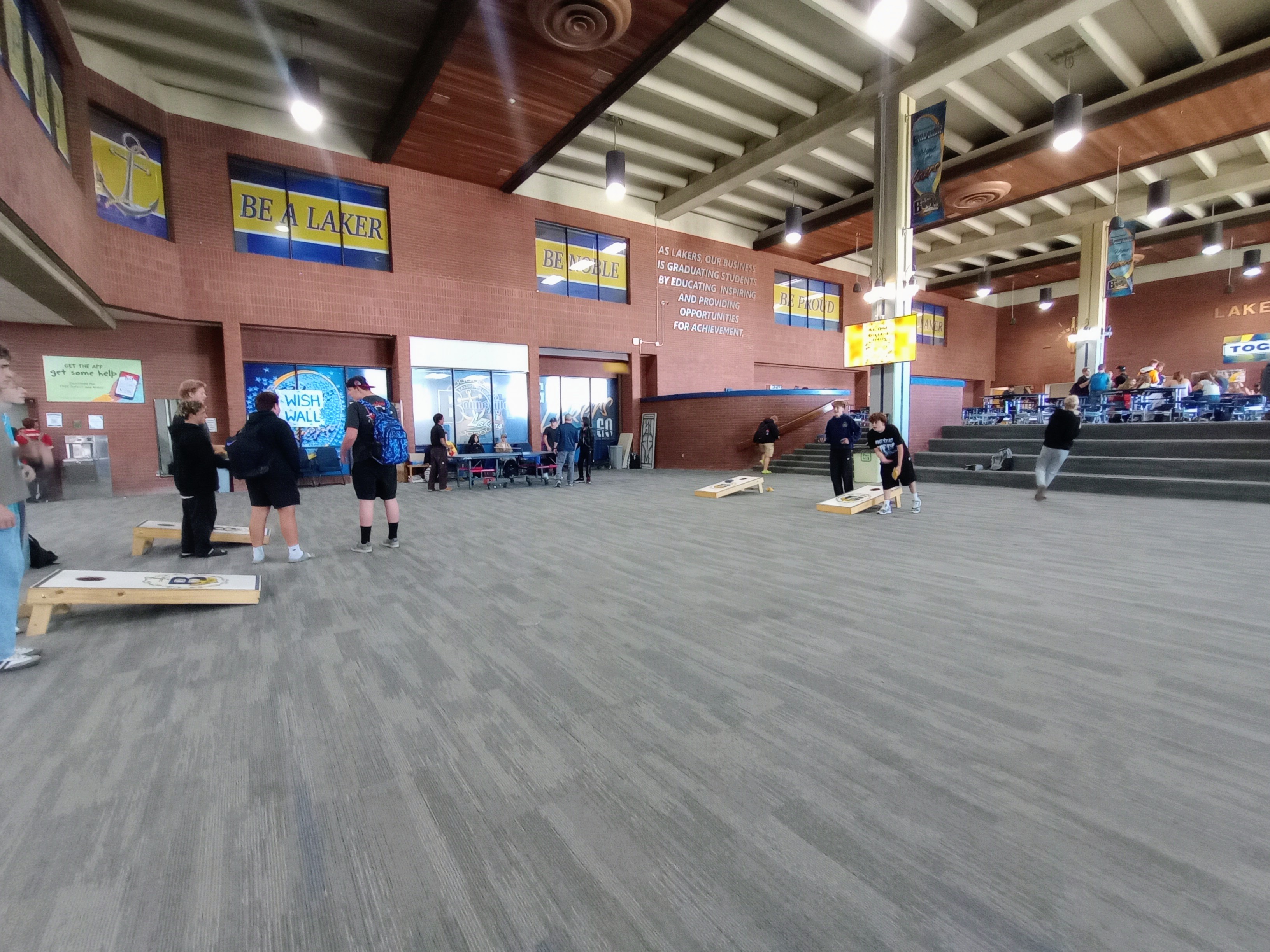 Students playing cornhole
