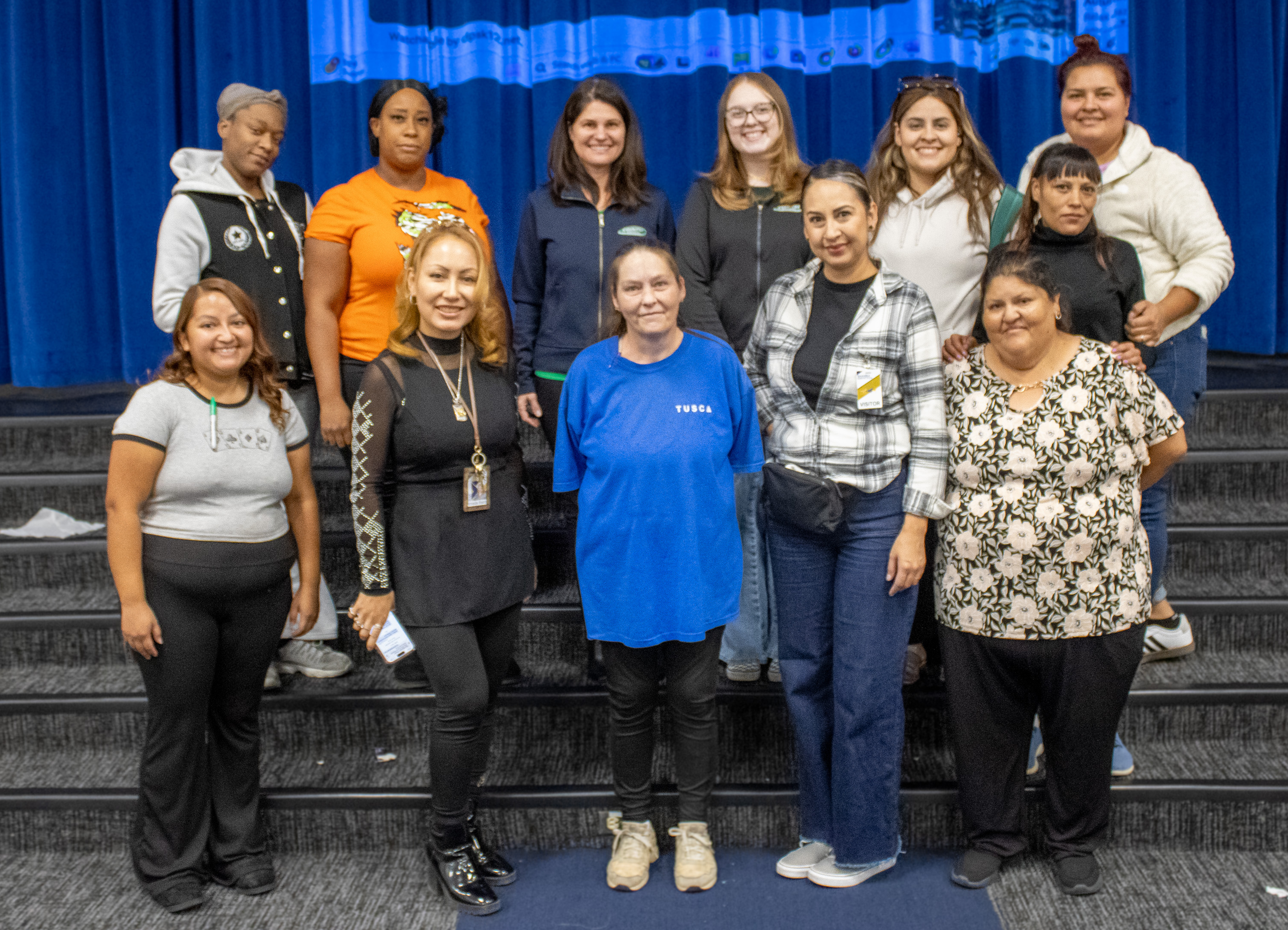 Volunteers from the coat distribution event pose for a photo.