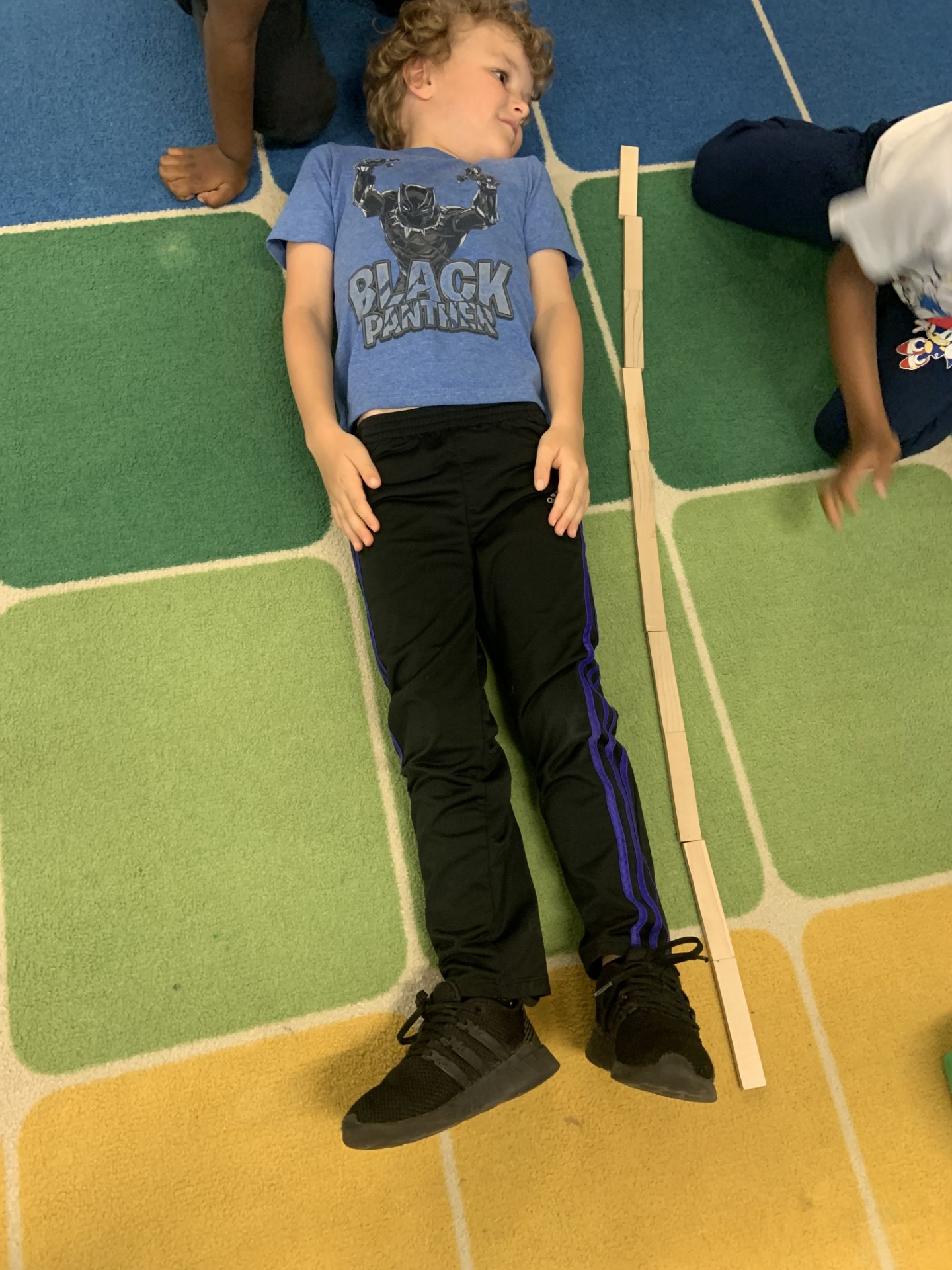 Measuring student's height with blocks