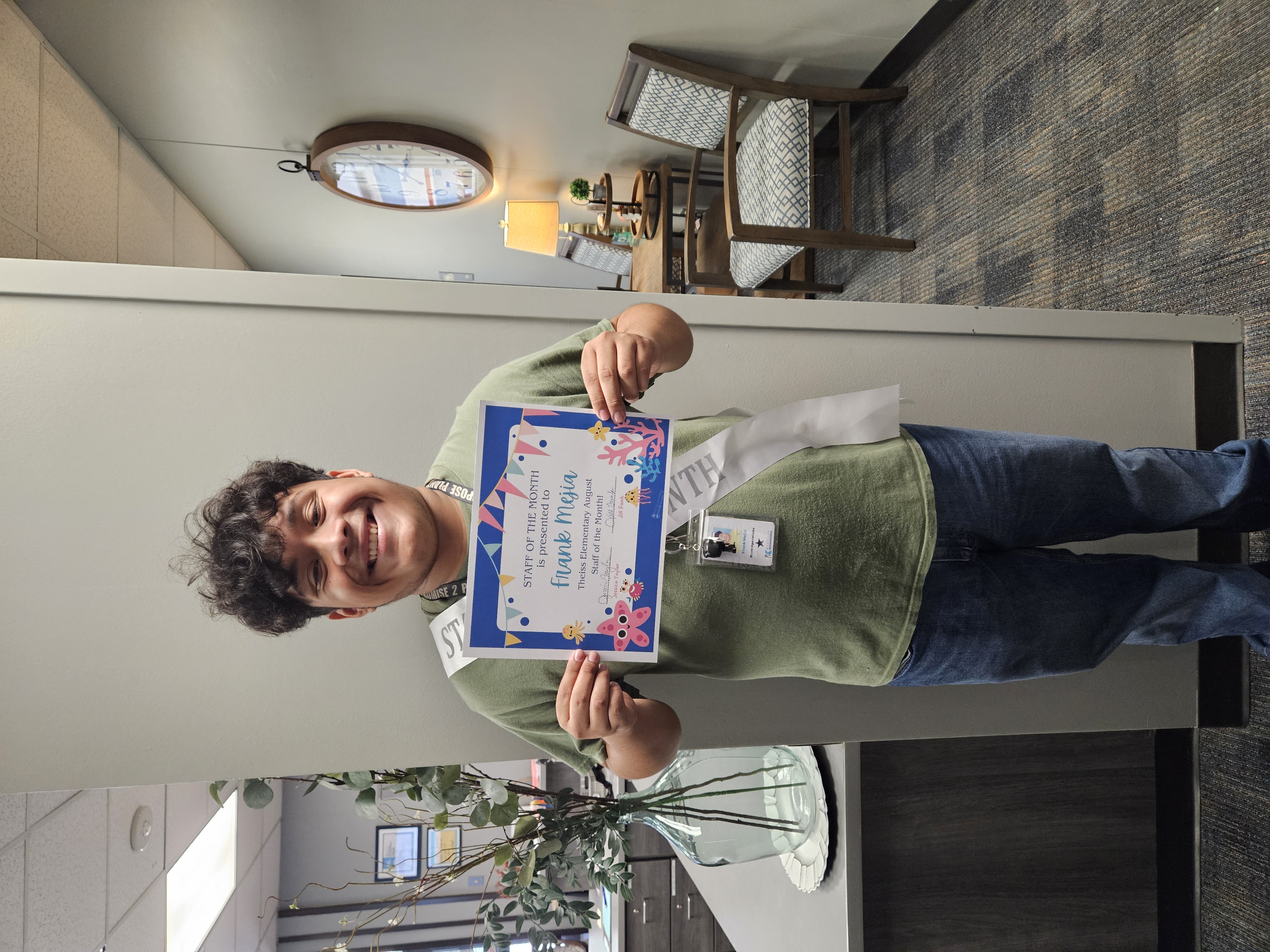 male staff member smiling