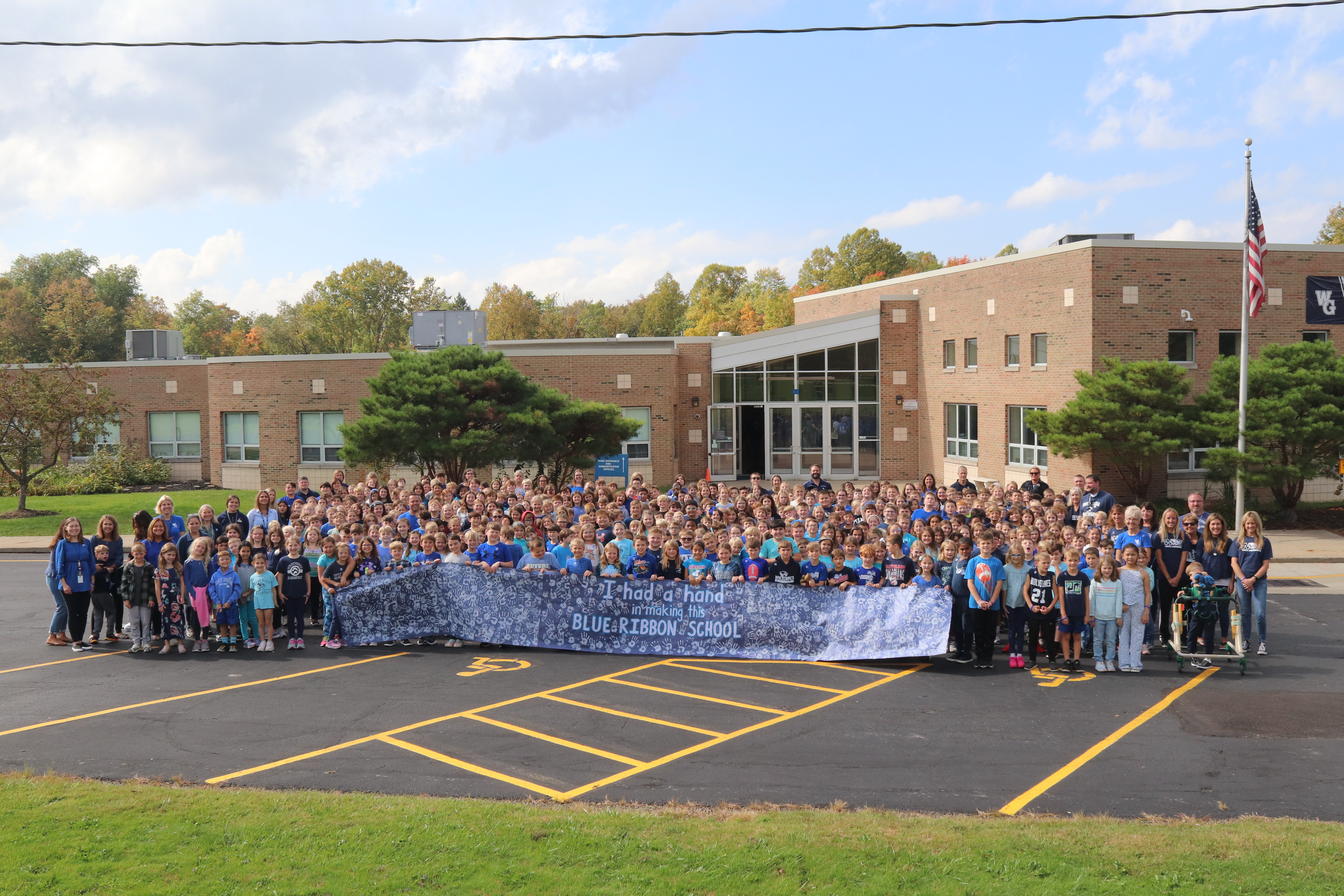 Students holding sign
