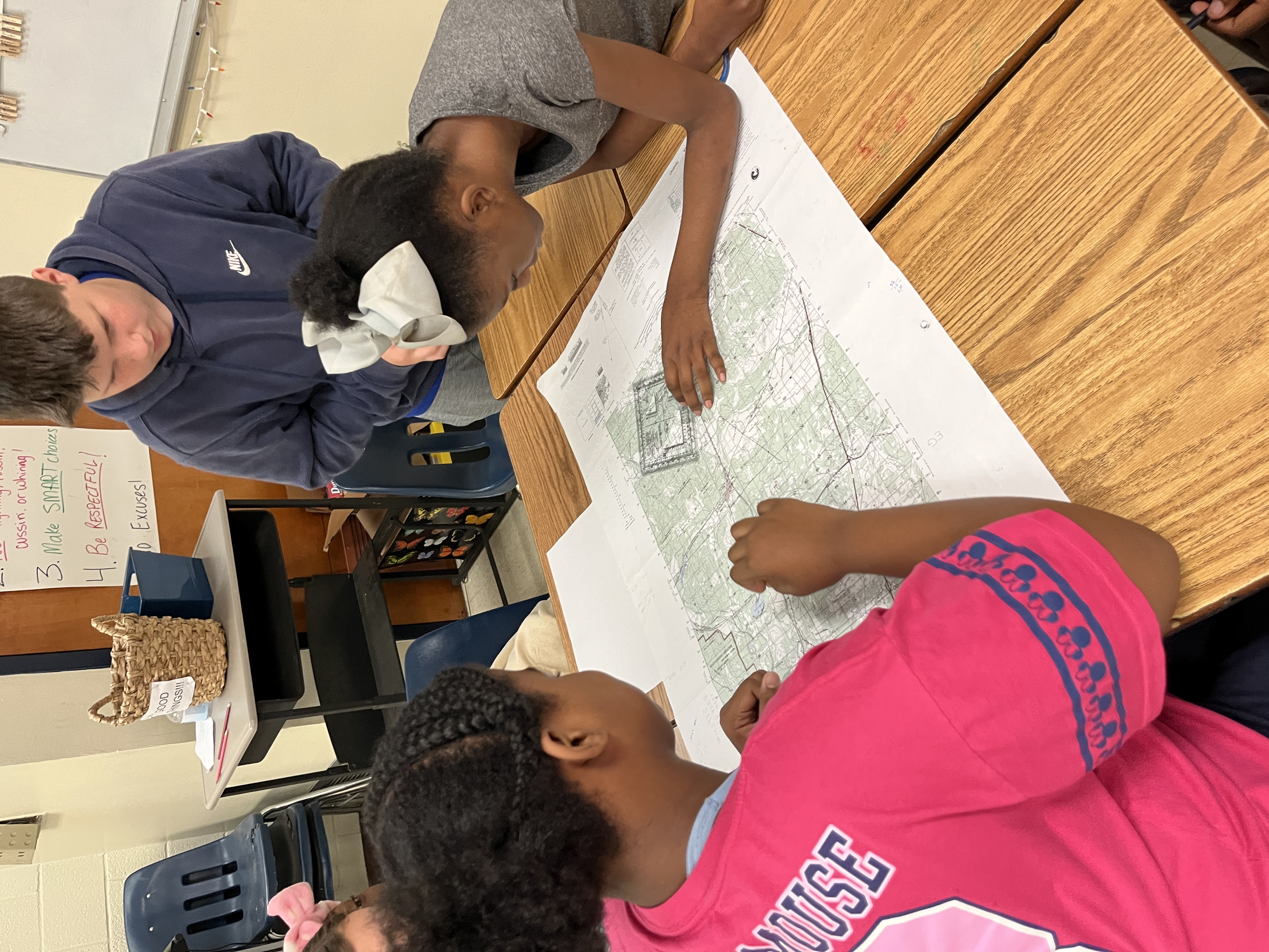 students looking at map