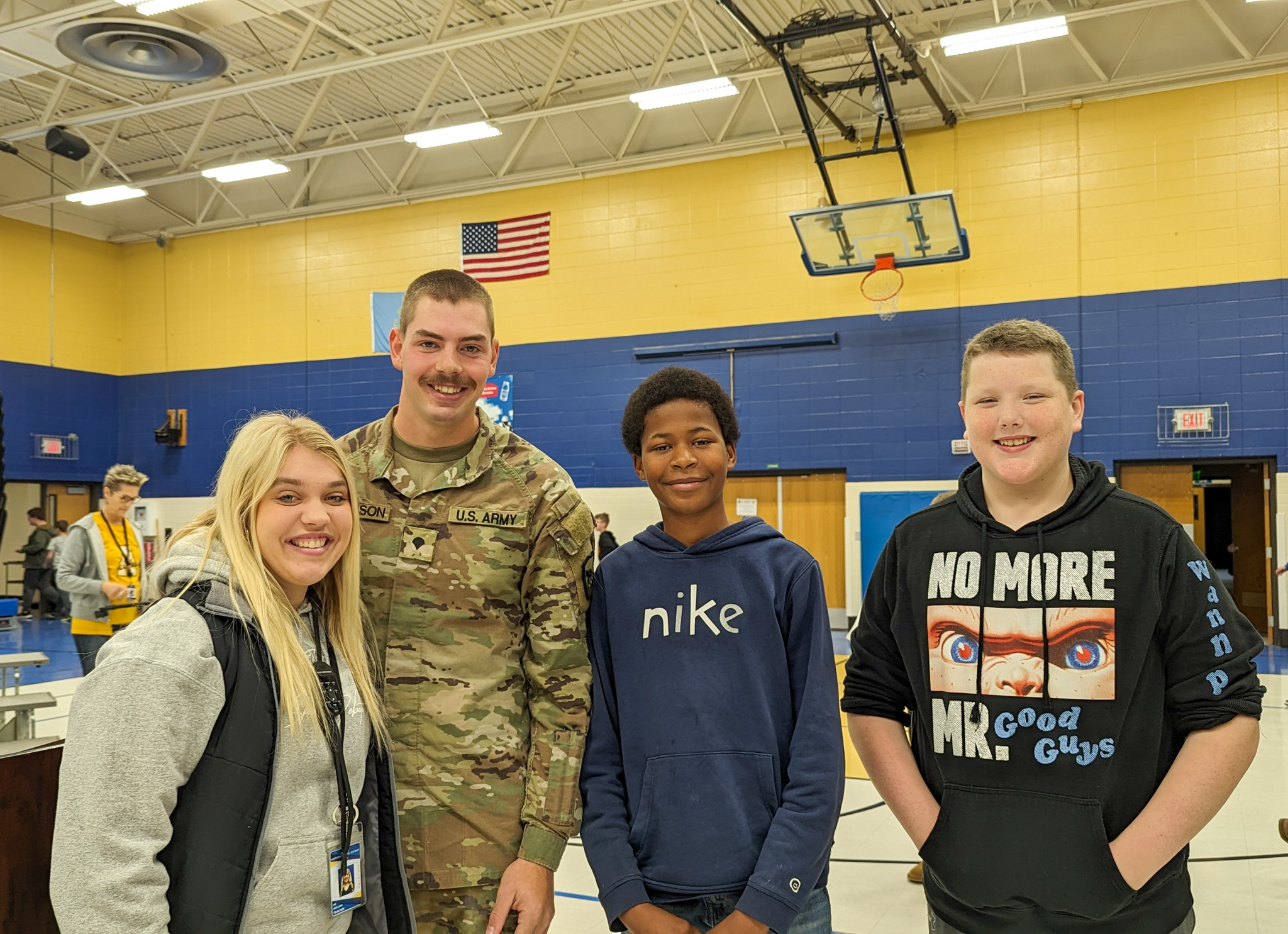 Students and teacher with veteran