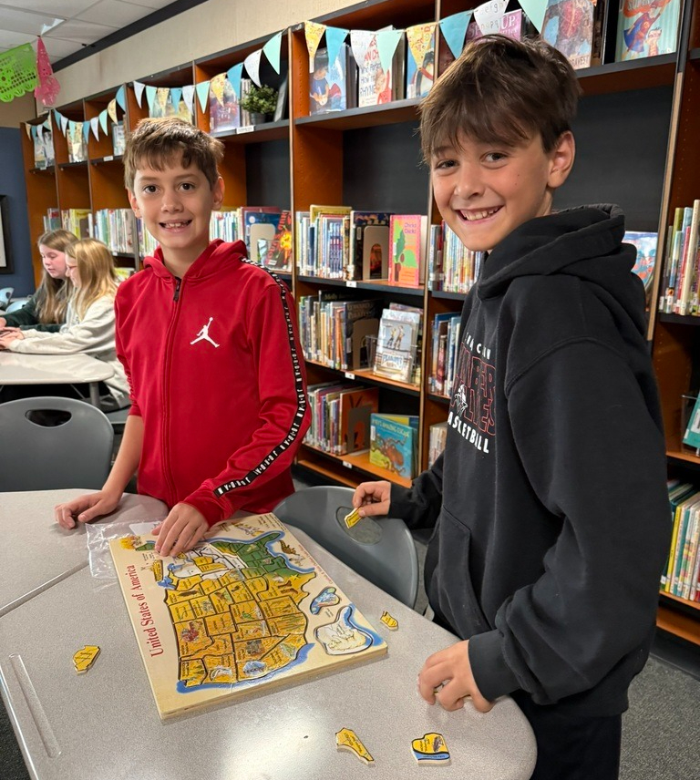 Southwood students doing a map puzzle