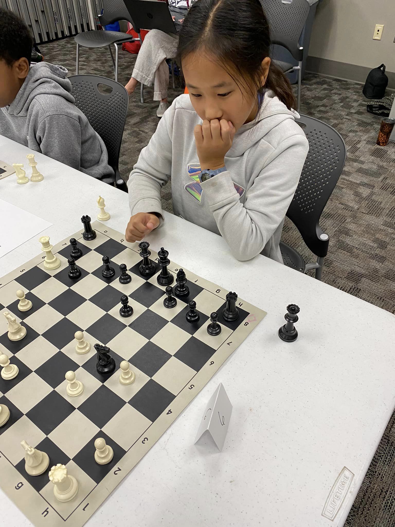 student playing chess