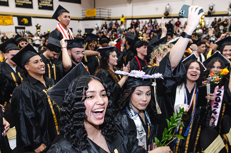 Graduates cheer at end of ceremony