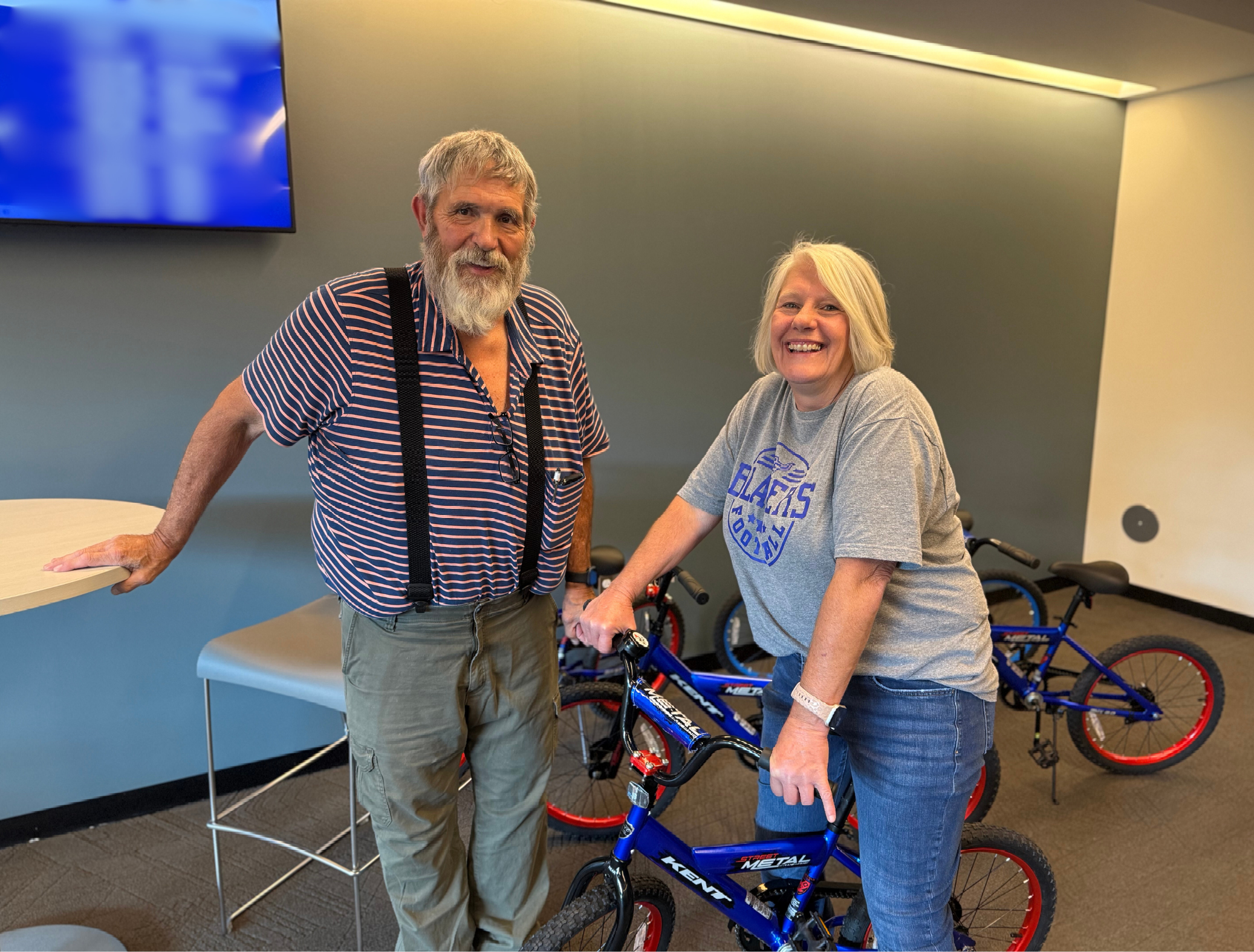 Photo of Tim Meek and Sharon Meek (Sharon riding a blue bicycle)