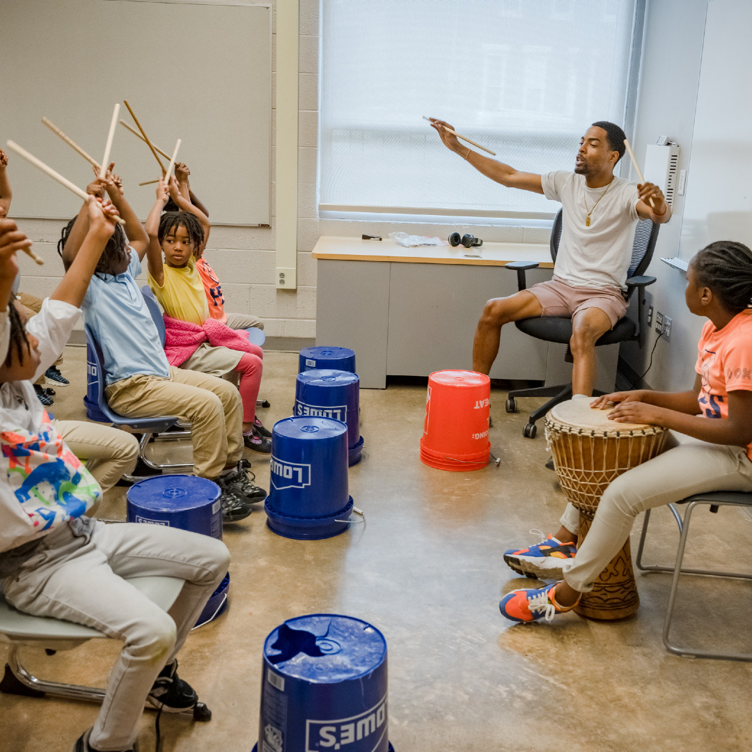 students with music teacher