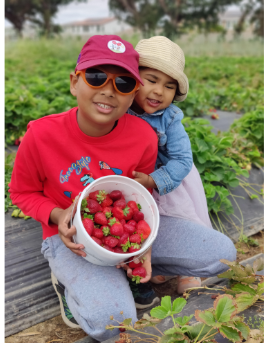 Safwan and sister with strawberries