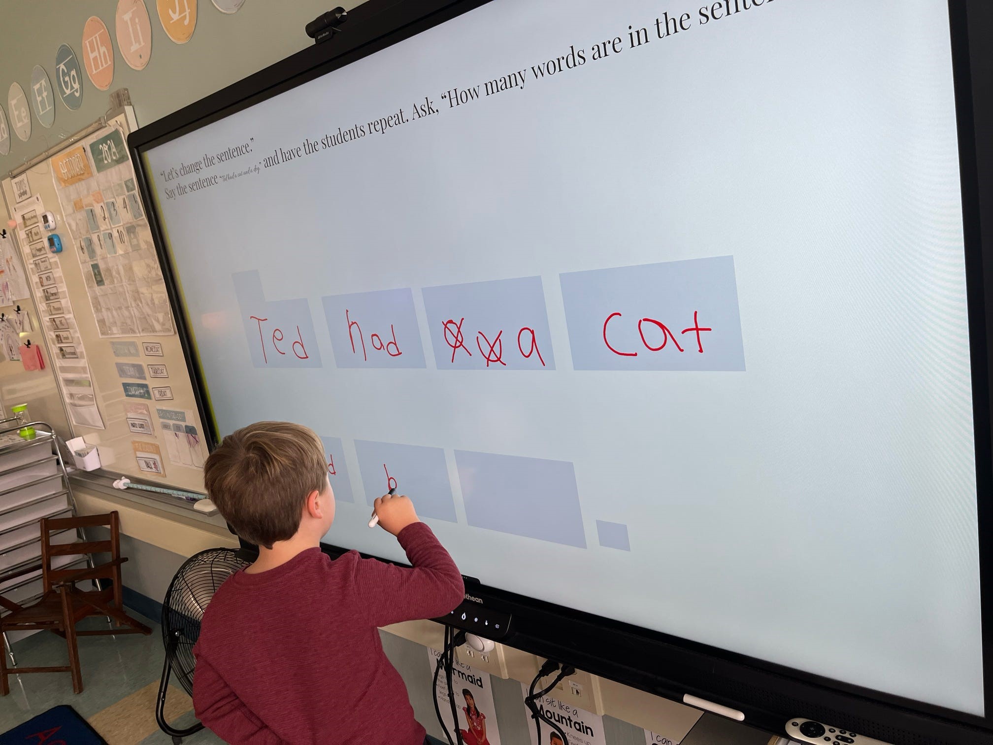 writing words in first grade on the board.