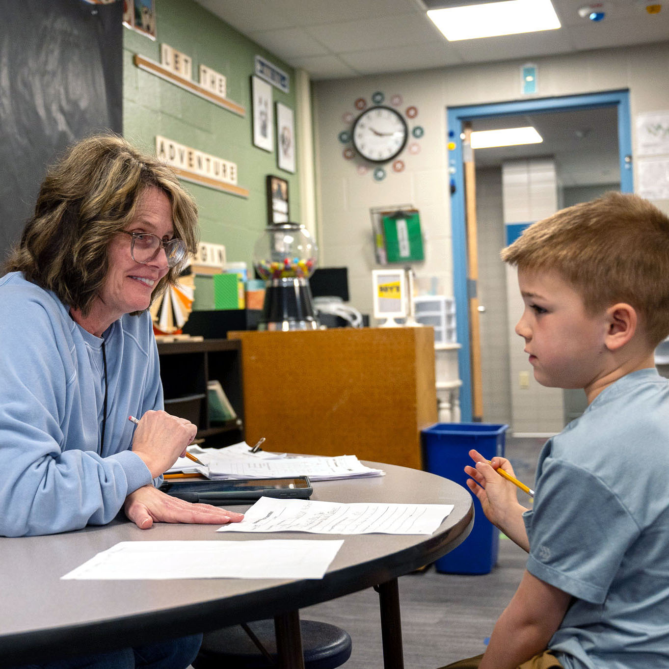 Staff working with student