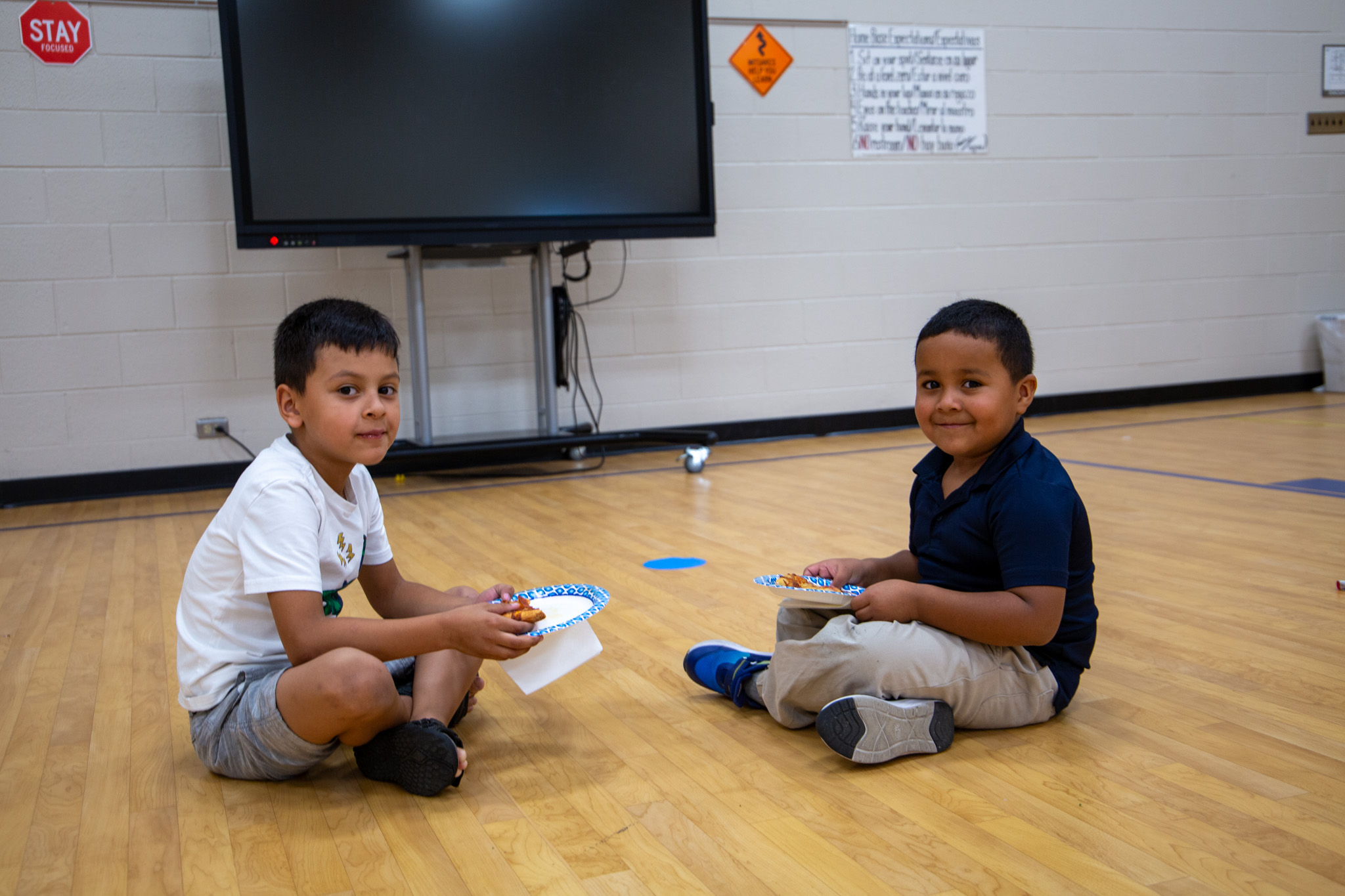 Two students smile for a photo at K-3 Literacy Night