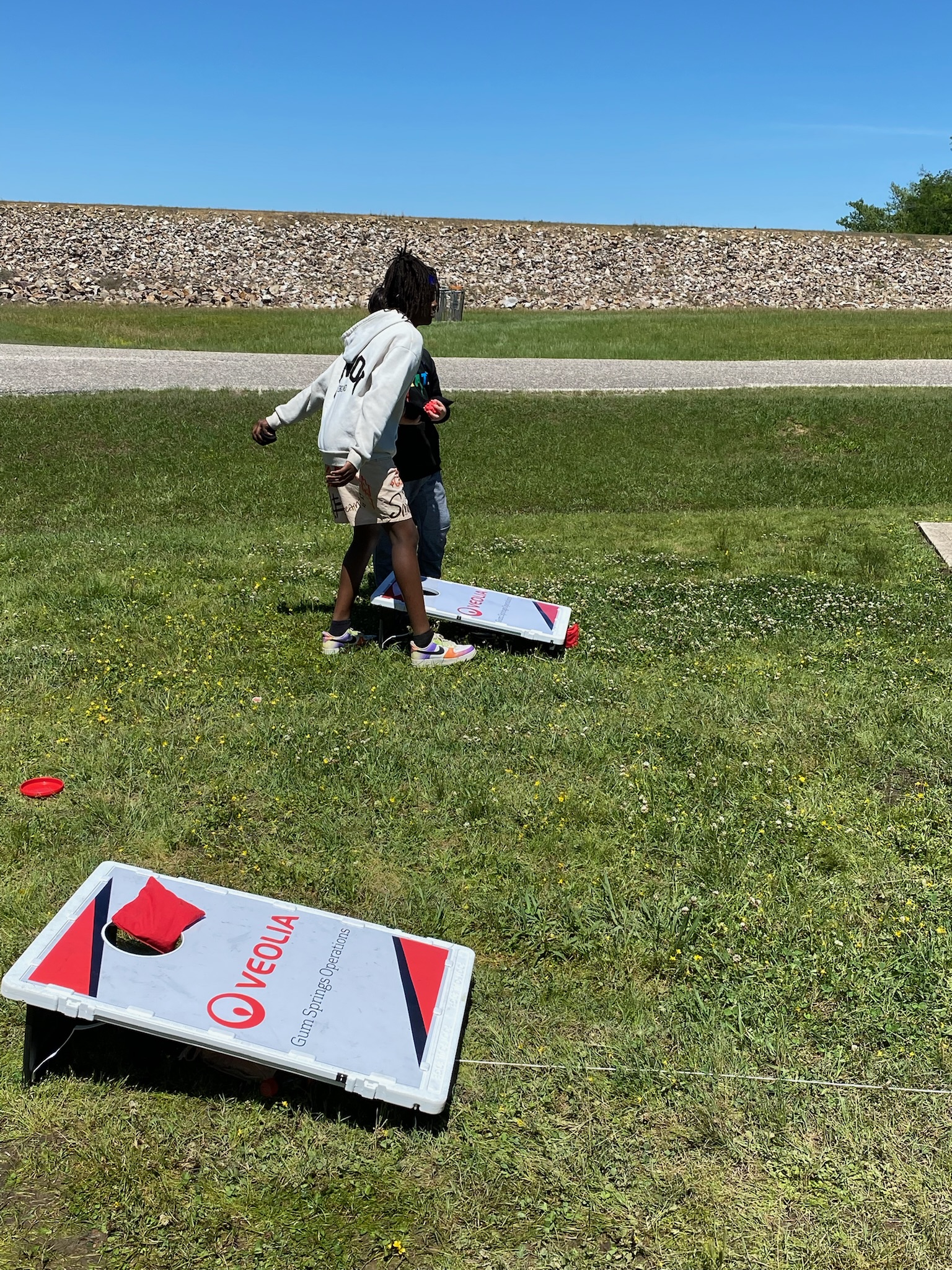 students playing cornhole