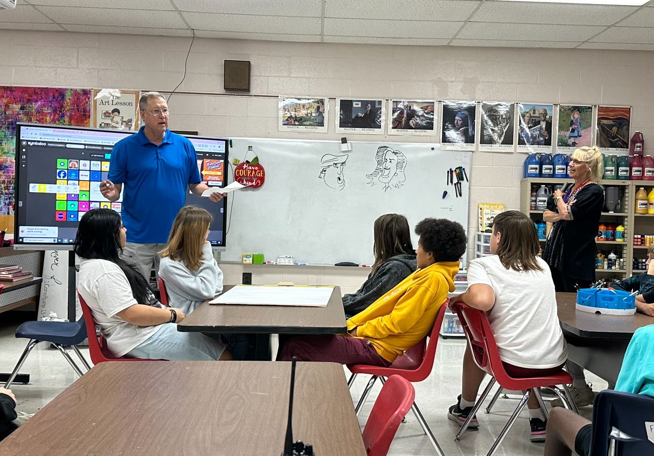 Coach Greer visits art class