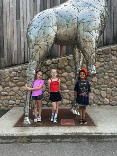 Students in front of statue