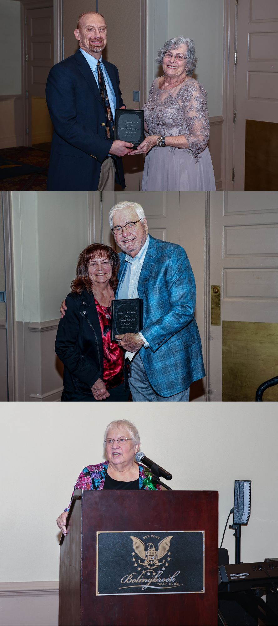 man and woman hold plaque, man and woman hold plaque, man's arm is around the woman, woman standing at podium
