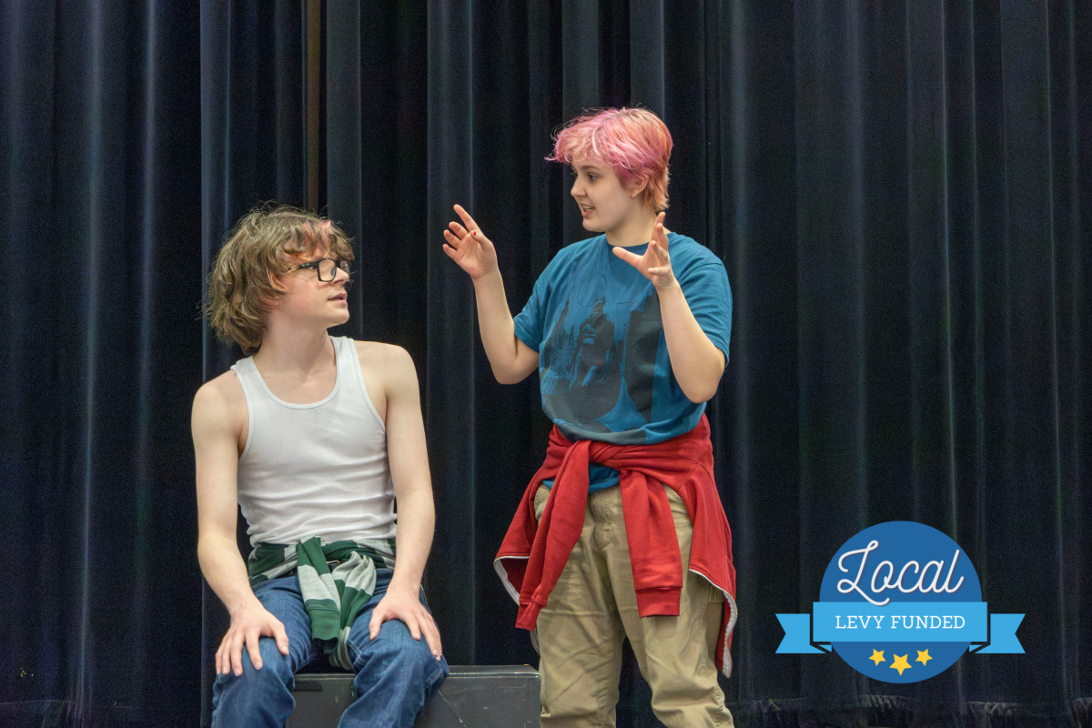 Two students practicing a play in high school