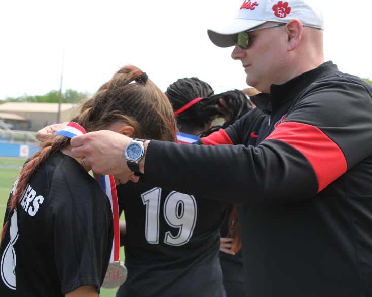 CHHS Soccer player with silver medal
