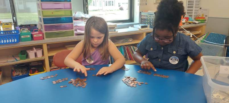 Students counting coins