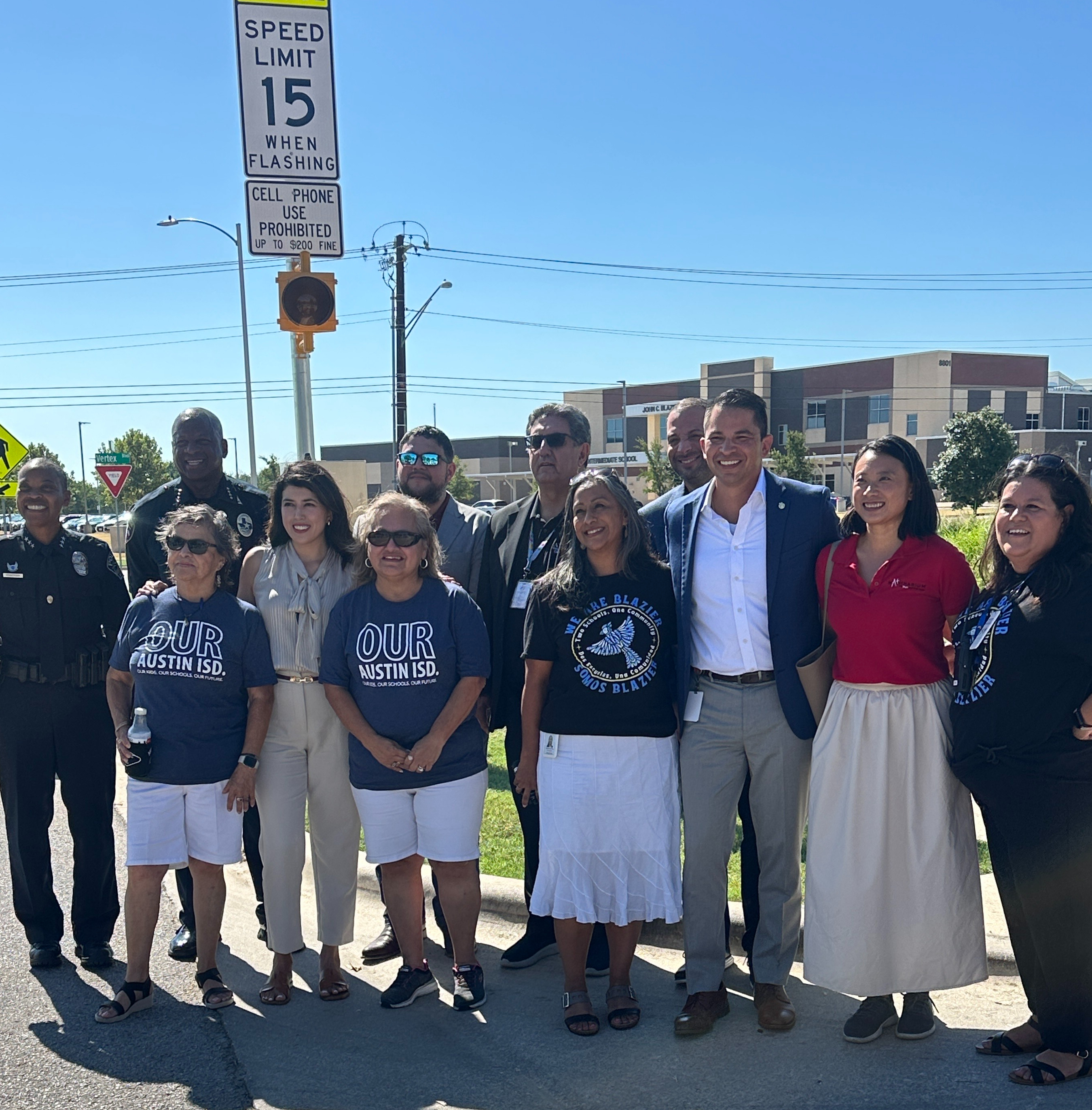 District and city leaders gather to celebrate new school zone beacons.