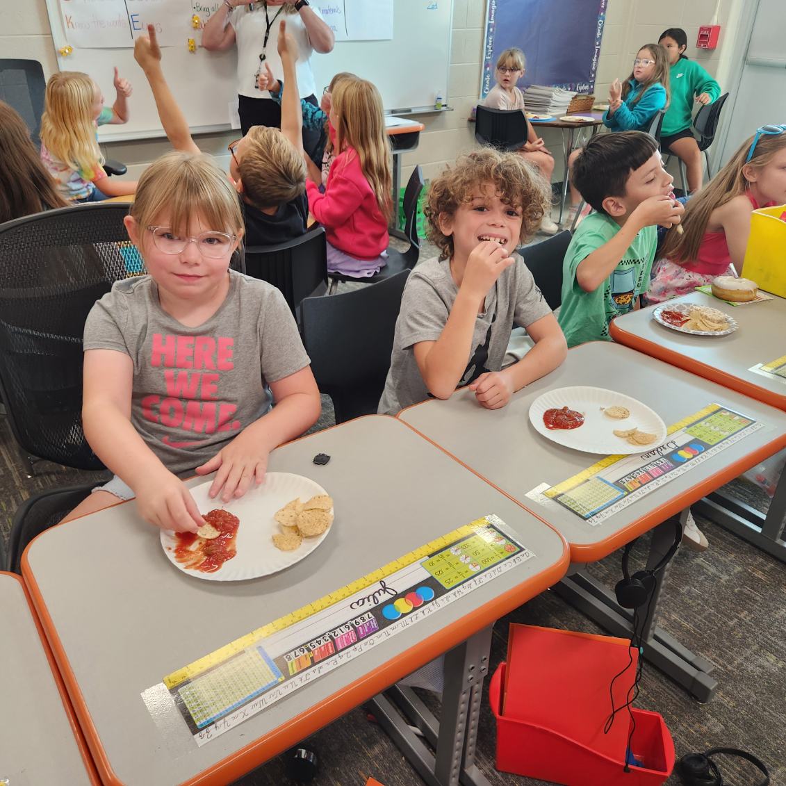 This is Mrs. Gray's Class learning about adjectives with rice cakes, chips, and salsa.