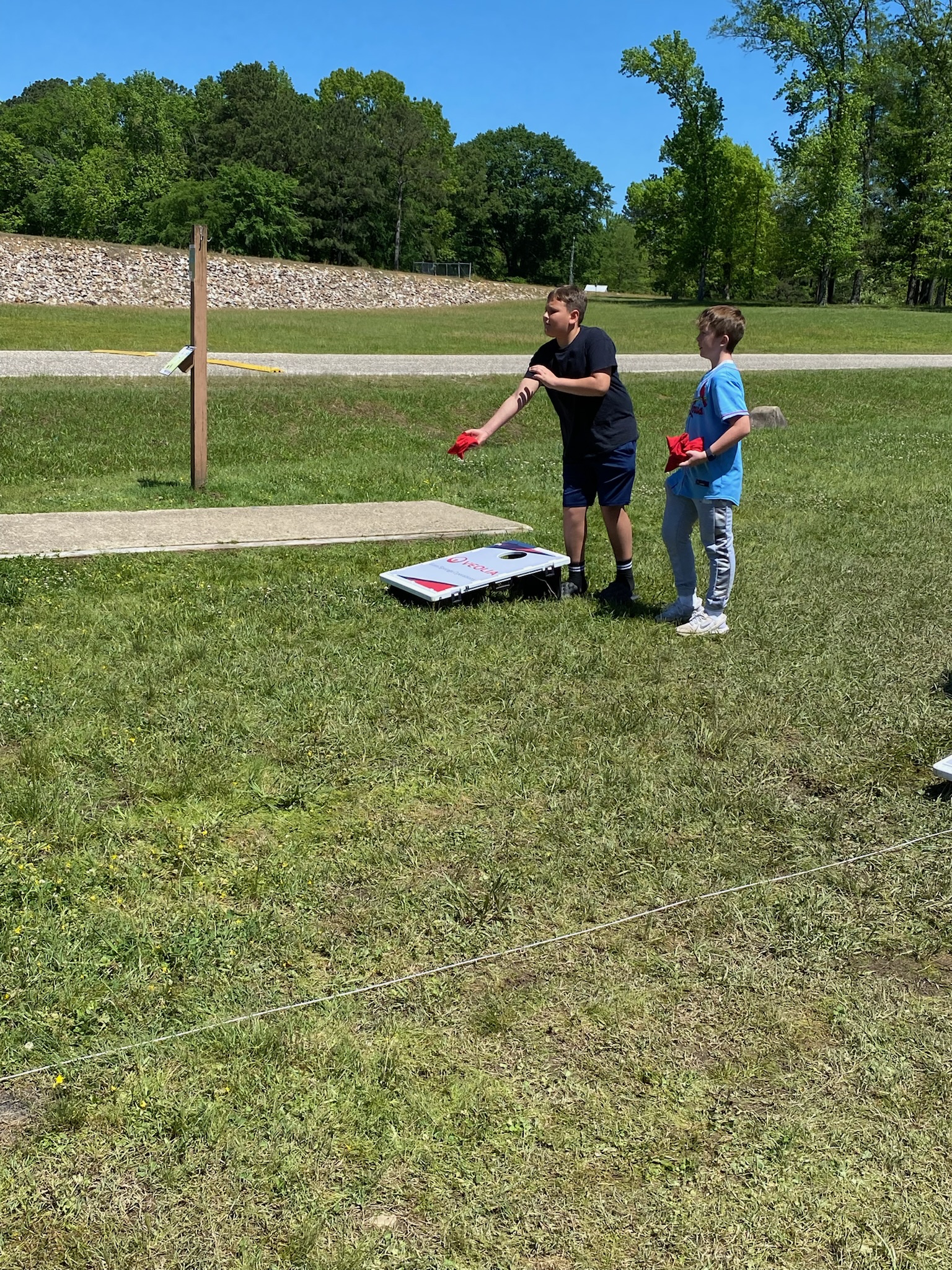 students playing cornhole