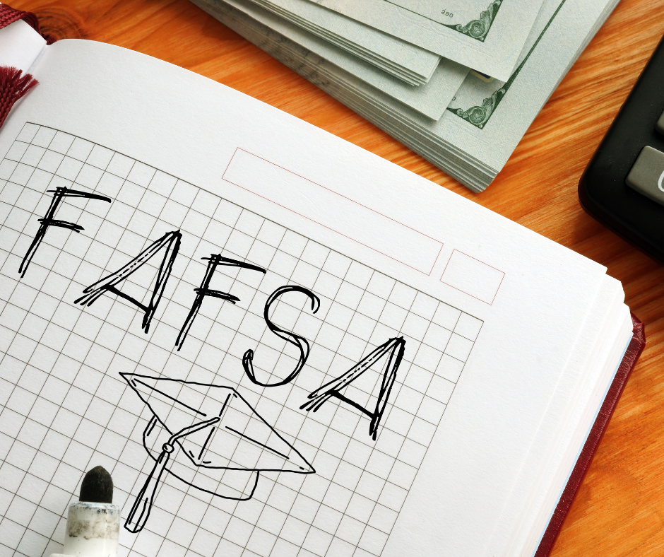 Drafting notebook with the word "FAFSA" and graduation cap drawn on page