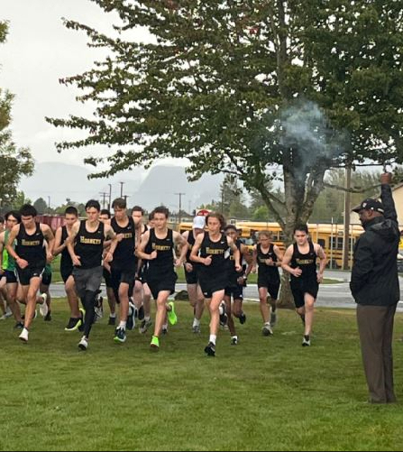 Dr. Carey serving as the starter for cross country meet