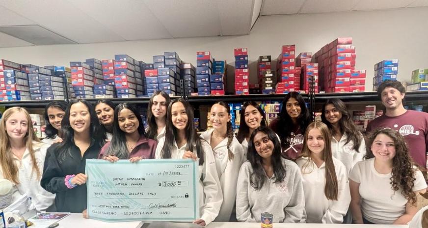 The Girls Tennis team of Wayne Hills High School raised a whopping $3000 in support of the local Wayne Interfaith Network (WIN) pantry. WIN supports the food needs of nearly 200 Wayne families. WIN President, Barbara Cohen, said that $3000 amount raised by a single sports team was unheard of and that it was almost twice the amount of the next largest donation they normally get. Kudos to the girls and their Coach Greene on this fantastic effort!
