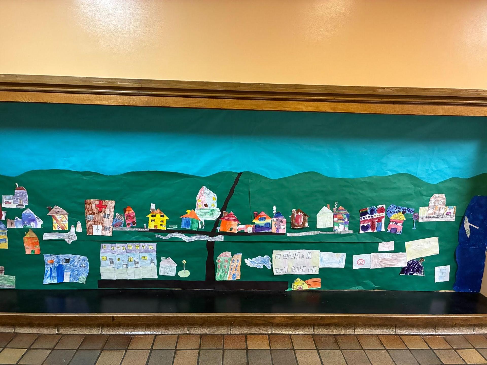 a blue and green mural in the hallway of BJM. 