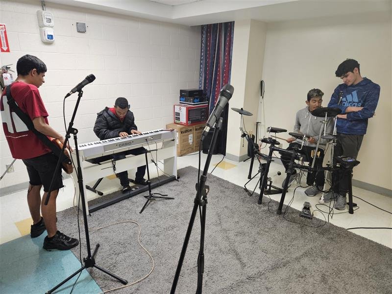 The boys jamming in the band room