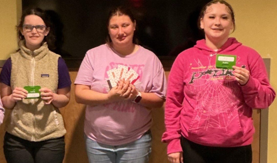 Meadow, Teagan and Briella showing off their gift cards