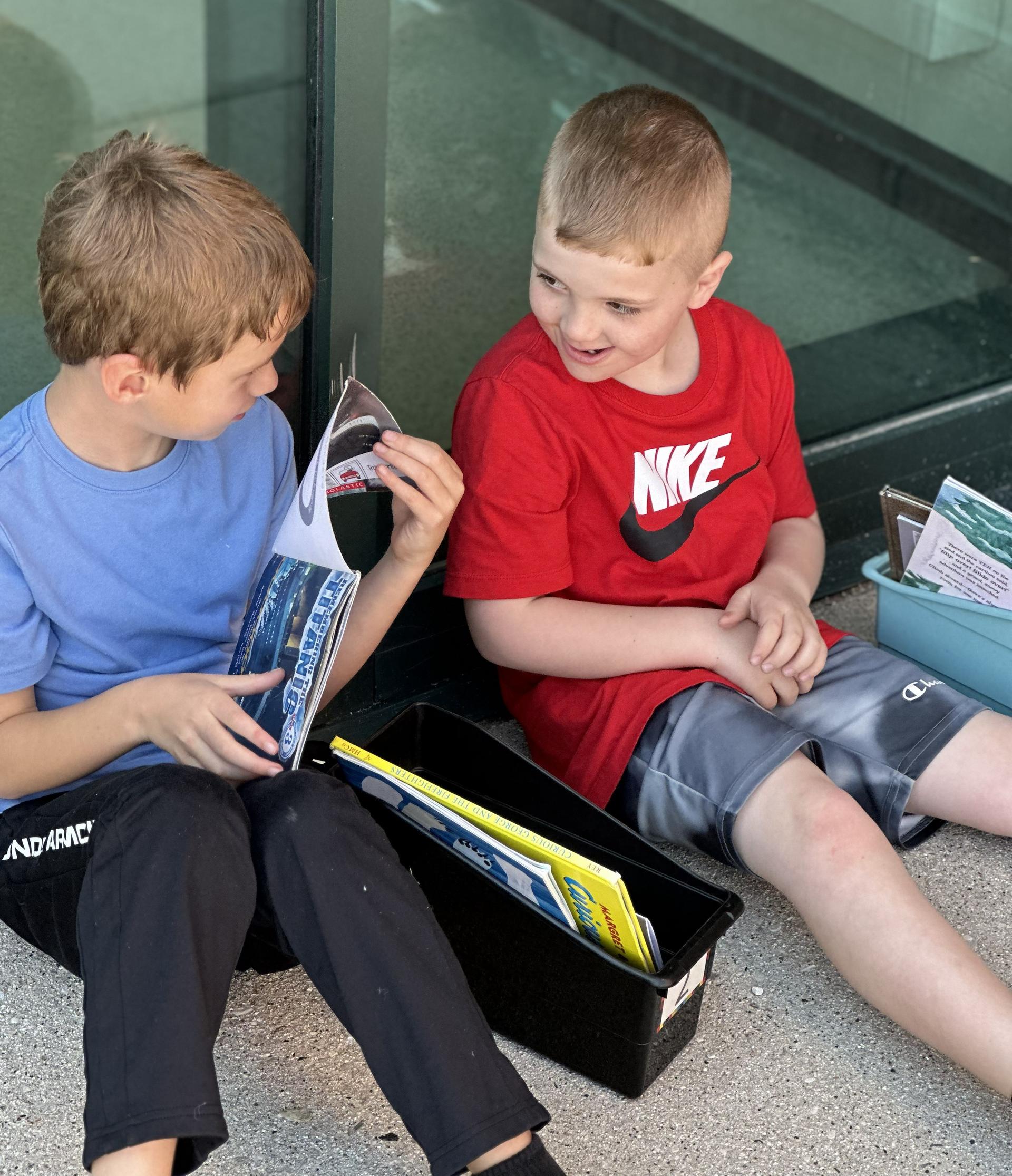 Elementary School students reading outside
