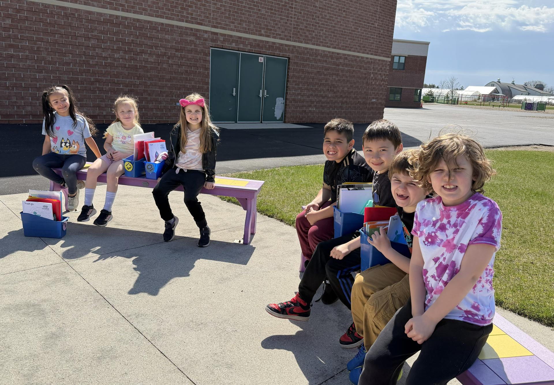 Elementary School students reading outside